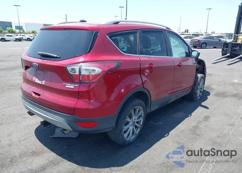 2017 Ford Escape Titanium z USA, uszkodzony, nr VIN 1FMCU0J9XHUB30897